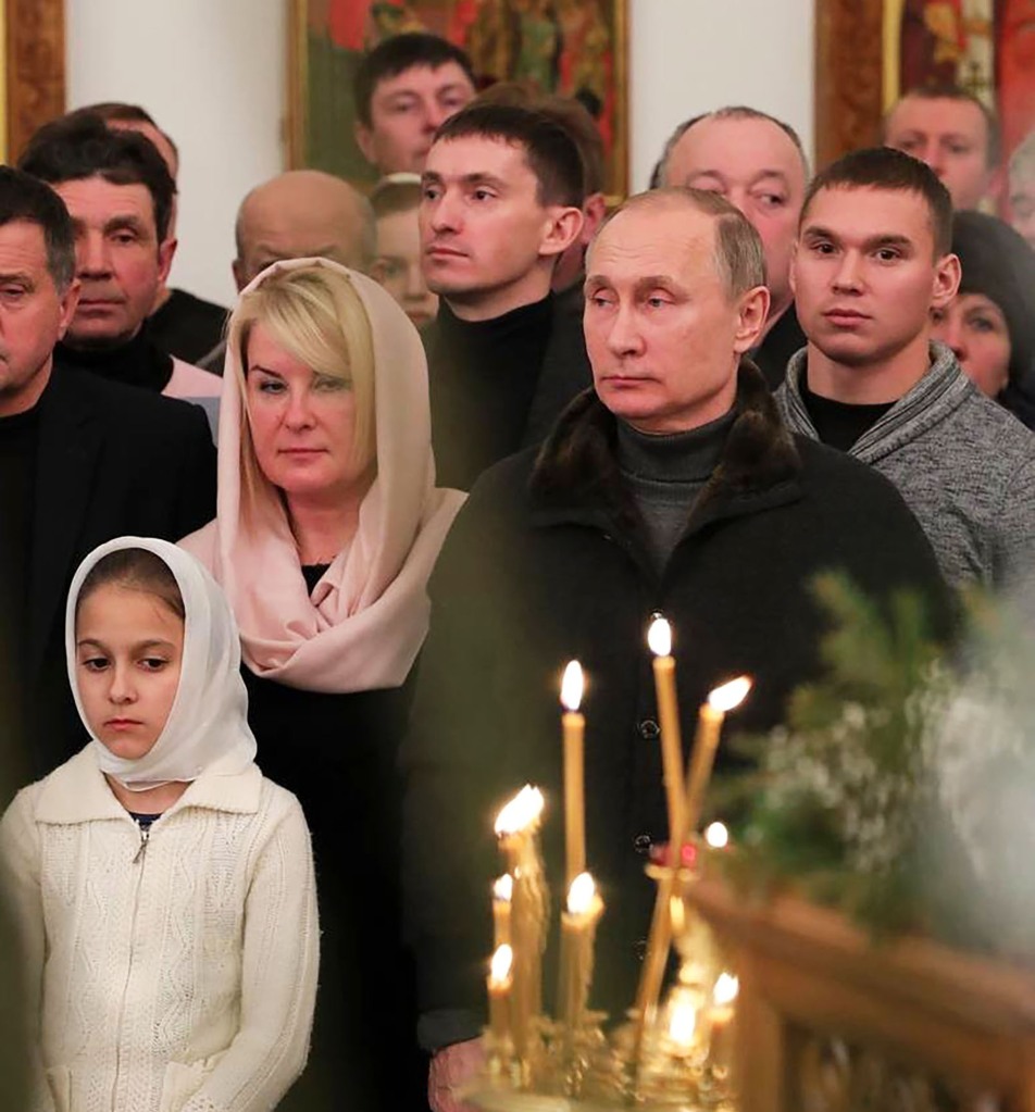 Putin and the mystery woman at Christmas services