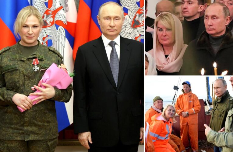 Why does mystery blonde keep popping up in Putin photo ops?