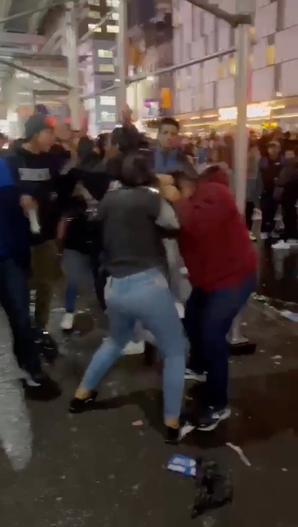 A video clip obtained by the Post Tuesday, Jan. 10, 2023, shows two migrants fighting outside the Row NYC hotel near Times Square during New Year's Eve festivities last week.