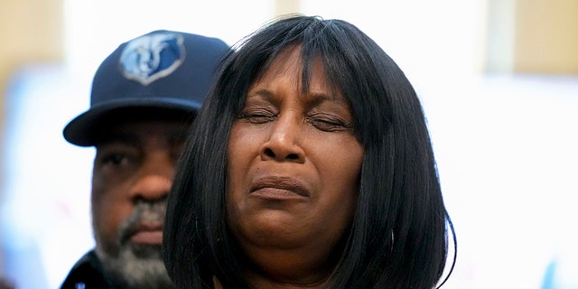 RowVaughn Wells, mother of Tyre Nichols, who died after being beaten by Memphis police officers, is comforted by Tyre's stepfather Rodney Wells, at a news conference with civil rights Attorney Ben Crump in Memphis, Tenn., on Friday.