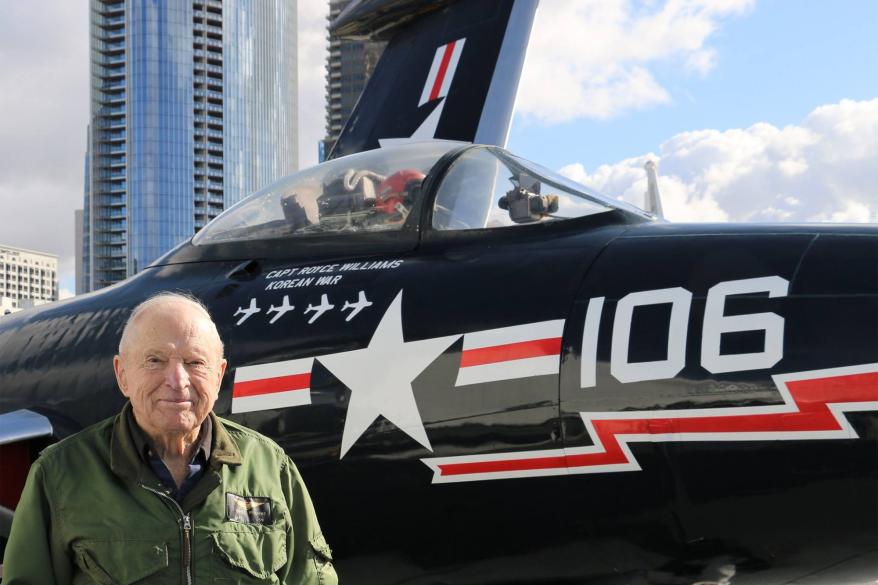 Williams poses in front of his F9F Panther.