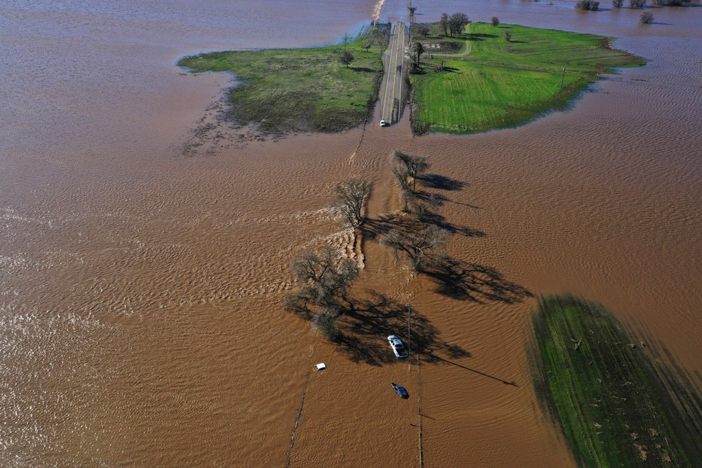 Three vehicles are submerged on Dillard Road west of Highway 99 in south Sacramento.