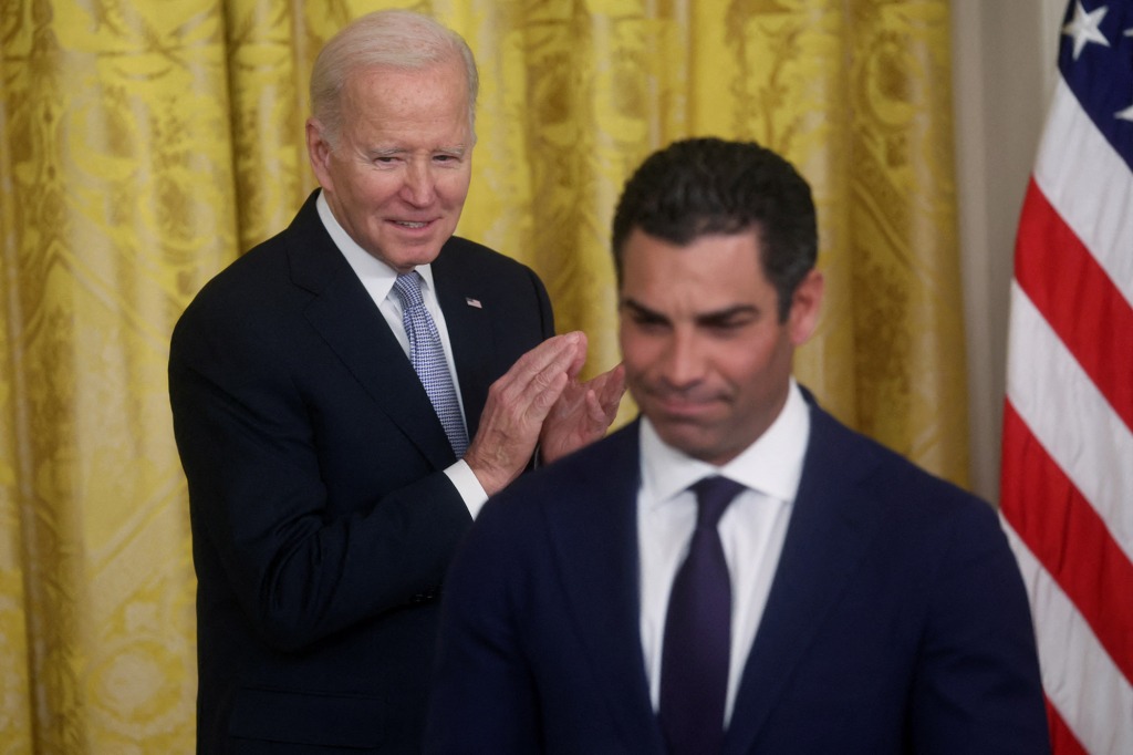 U.S. President Joe Biden applauds after Francis Suarez, President of the U.S. Conference of Mayors and Mayor of Miami, Florida, gave a speech in the East Room at the White House in Washington, U.S., January 20, 2023. 