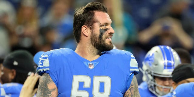 Detroit Lions offensive tackle Taylor Decker (68) walks on the field ahead of a game against the Jacksonville Jaguars in Detroit, Dec. 4, 2022. 