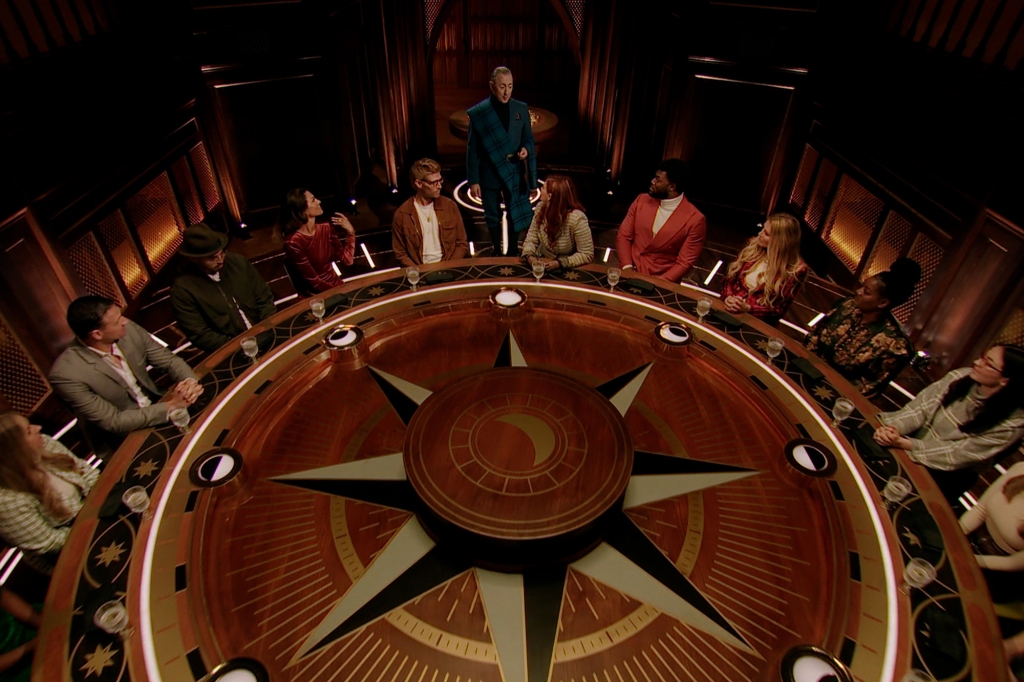 Cast members sit at the round table in "The Traitors." 