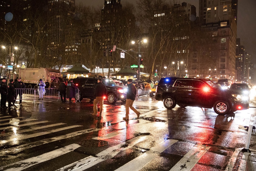 Police cars are seen at 42nd St. and 6th Ave. at the scene of a stabbing Saturday, Dec. 31, 2022. 