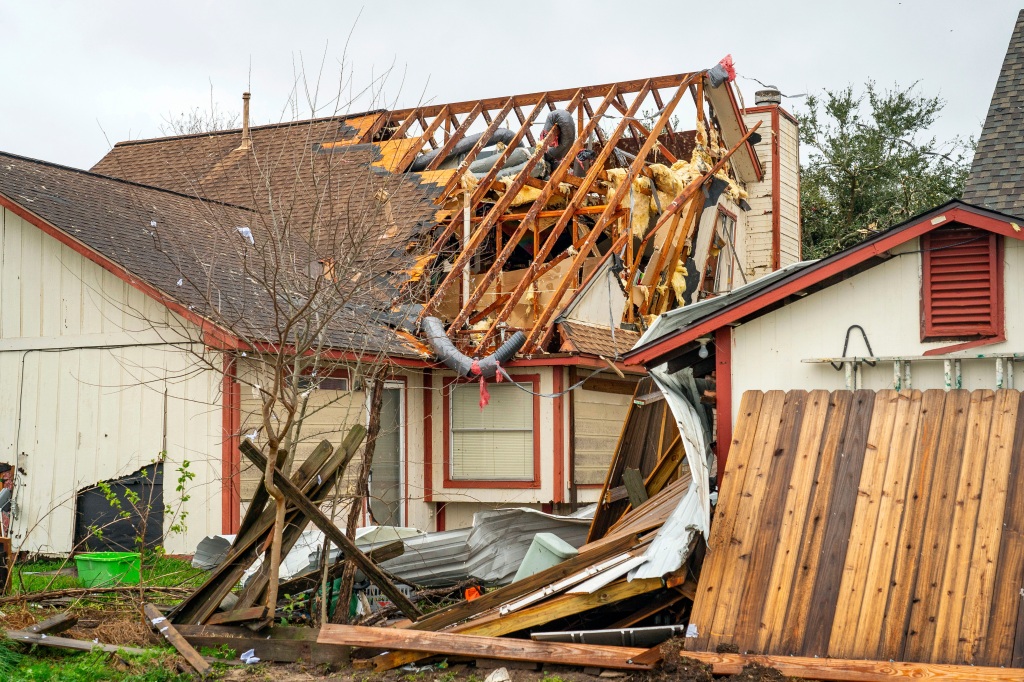 A home is damaged on Kent Drive where a tornado was reported to pass near Mickey Gilley Blvd. and Fairmont Parkway on Jan. 24, 2023, in Pasadena, Texas.