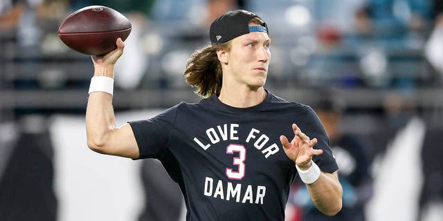 Trevor Lawrence of the Jacksonville Jaguars warms up while wearing a shirt in support of Buffalo Bills safety Damar Hamlin prior to a game against the Tennessee Titans at TIAA Bank Field Jan. 7, 2023 in Jacksonville, Fla. 