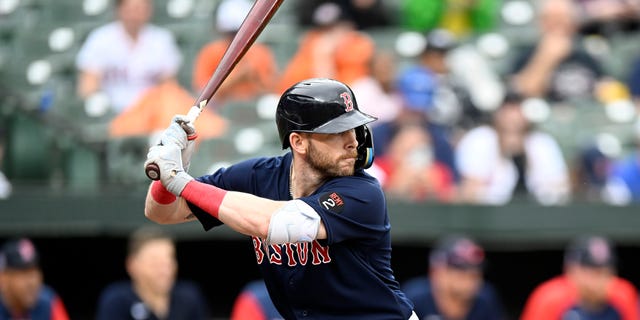 Trevor Story #10 of the Boston Red Sox bats against the Baltimore Orioles at Oriole Park at Camden Yards on September 11, 2022 in Baltimore, Maryland.