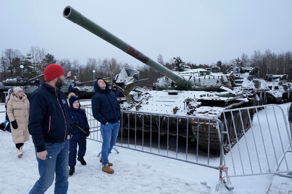 Pictured are visitors at an exhibition of tanks and APCs of Ukrainian armed forces damaged and captured during fighting.