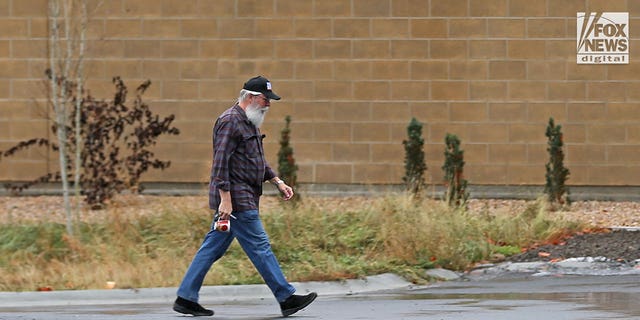 Latah County Prosecuting Attorney Bill Thompson is seen arriving at the Moscow Police Station on Sunday, Nov. 27, 2022 as investigators worked through Thanksgiving on the shocking stabbing murders of four University of Idaho students. 