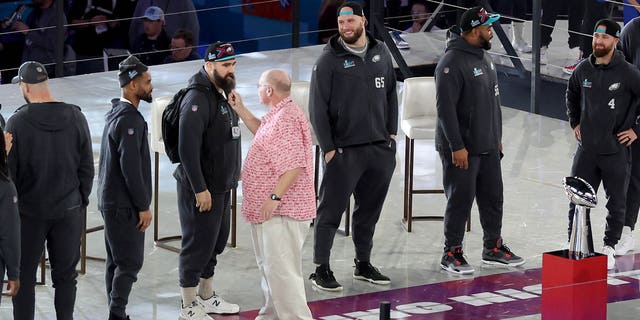 Head coach Andy Reid of the Kansas City Chiefs pulls on the beard of Jason Kelce of the Philadelphia Eagles during Super Bowl LVII Opening Night presented by Fast Twitch at Footprint Center Feb. 6, 2023, in Phoenix, Ariz.