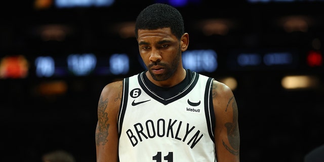 Brooklyn Nets guard Kyrie Irving reacts against the Phoenix Suns in the first half at Footprint Center Jan 19, 2023, in Phoenix, Ariz. 