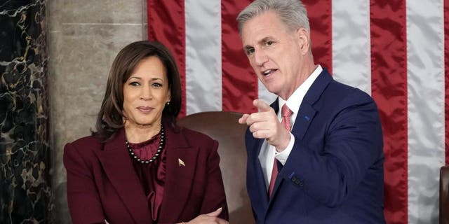 Vice President Kamala Harris talks with House Speaker Kevin McCarthy.