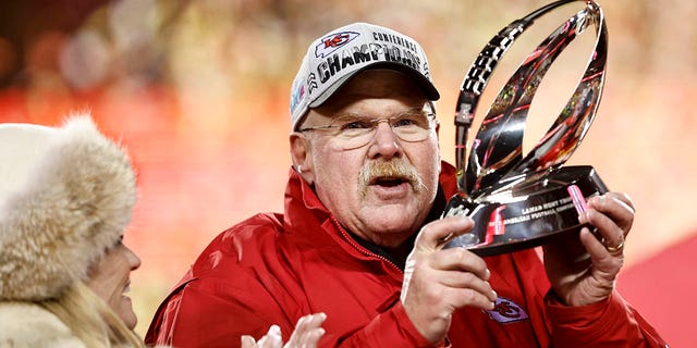 Kansas City Chiefs head coach Andy Reid celebrates with the Lamar Hunt Trophy after winning the AFC championship game against the Cincinnati Bengals at GEHA Field at Arrowhead Stadium Jan. 29, 2023, in Kansas City, Mo.