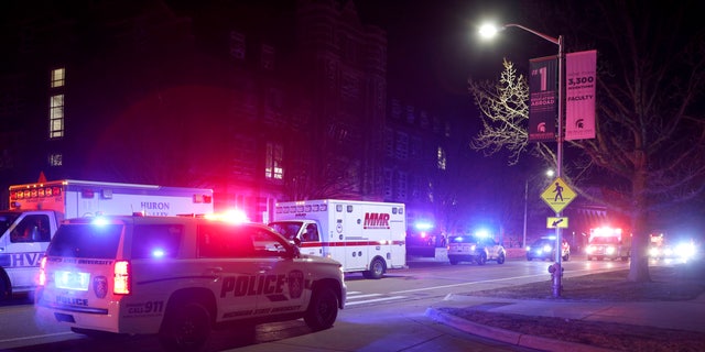 First responders stage outside Berkey Hall on the campus of Michigan State University, late Monday, Feb. 13, 2023, in East Lansing, Mich. (AP Photo/Al Goldis)