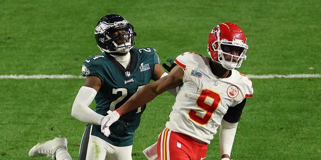 James Bradberry #24 of the Philadelphia Eagles is called for holding against JuJu Smith-Schuster #9 of the Kansas City Chiefs during the fourth quarter in Super Bowl LVII at State Farm Stadium on February 12, 2023 in Glendale, Arizona.