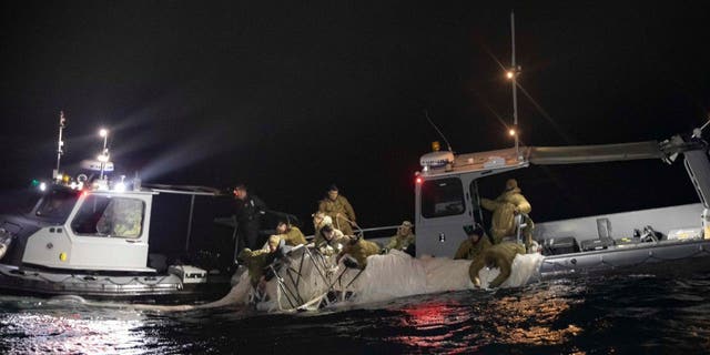 U.S. forces haul debris from China's surveillance balloon onto a boat off the coast of South Carolina. A military jet that shot down an object over Lake Huron, Michigan missed on its first attempt. 