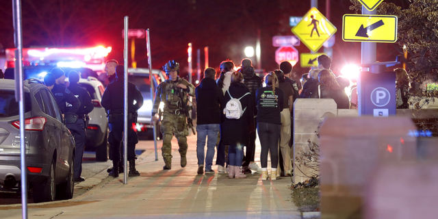 Students gather on the campus of Michigan State University after a shelter in place order was lifted early Tuesday, Feb. 14, in East Lansing, Michigan.