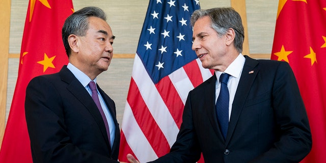 Secretary of State Antony Blinken, right, shakes hands with China's Foreign Minister Wang Yi during a meeting in Nusa Dua on the Indonesian resort island of Bali on July 9, 2022.