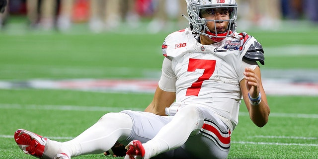 C.J. Stroud, #7 of the Ohio State Buckeyes, reacts after a sack during the fourth quarter against the Georgia Bulldogs in the Chick-fil-A Peach Bowl at Mercedes-Benz Stadium on Dec. 31, 2022 in Atlanta.