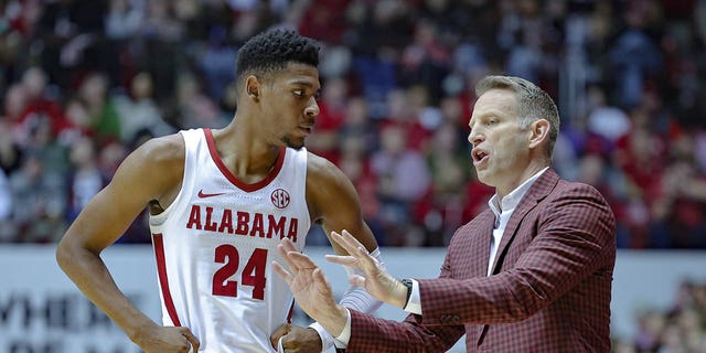 Head coach Nate Oats gives coaching advice to Brandon Miller (24) of the Alabama Crimson Tide during a timeout against the LSU Tigers at Coleman Coliseum Jan. 14, 2023, in Tuscaloosa, Ala. 