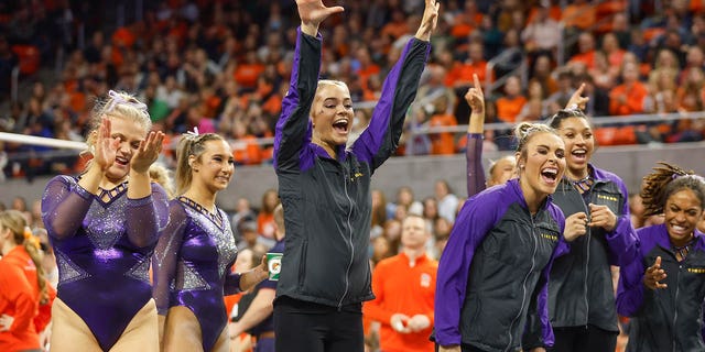 Olivia Dunne of LSU cheers on a teammate during a meet against Auburn at Neville Arena Feb. 10, 2023, in Auburn, Ala.