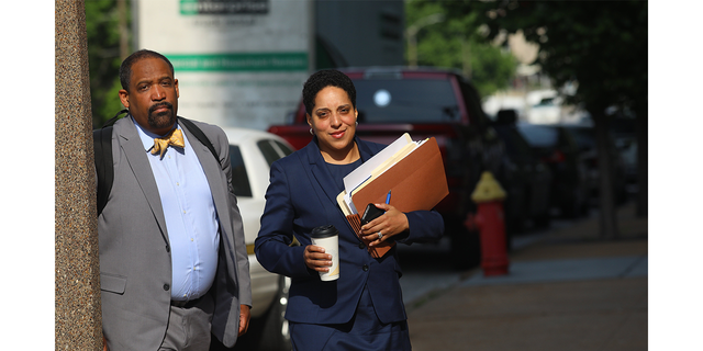 St. Louis Circuit Attorney Kim Gardner, right, and Ronald Sullivan, a Harvard law professor, arrive at the Civil Courts building on May 14, 2018. 