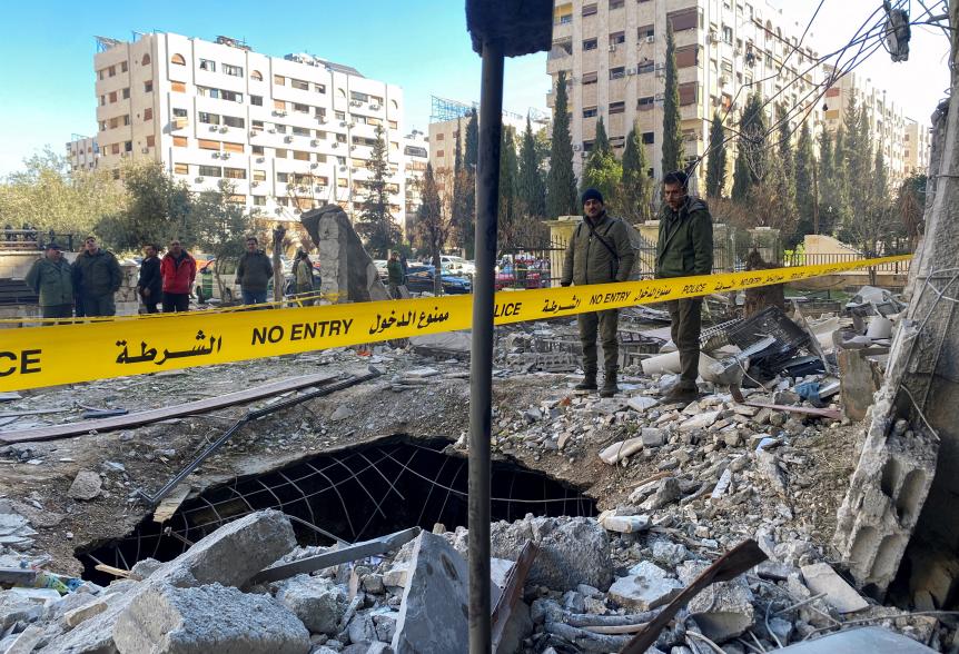 Rubble of a damaged building is taped off by police after a rocket attack hit Damascus, Syria on Feb. 19, 2023.