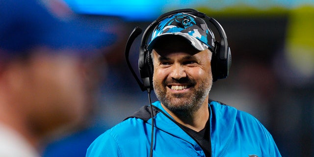 Carolina Panthers head coach Matt Rhule smiles during the first half of a preseason game against the Buffalo Bills Aug. 26, 2022, in Charlotte, N.C.