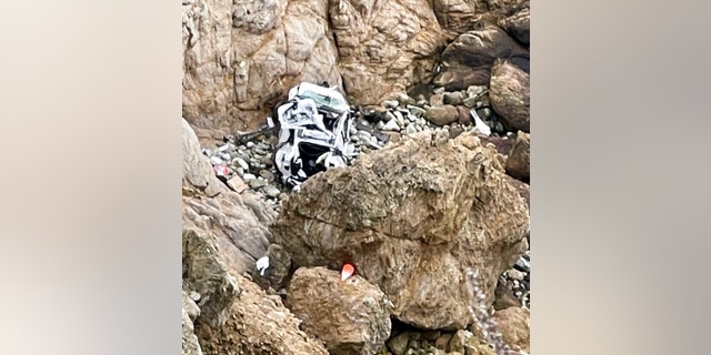 This image from video provided by San Mateo County Sheriff's Office shows a Tesla vehicle that plunged off a Northern California cliff along the Pacific Coast Highway, Monday, Jan. 2, 2023, near an area known as Devil's Slide.