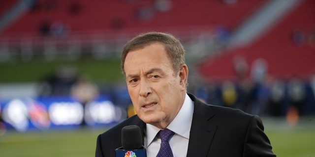 Al Michaels works on the sideline before an NFL  game between the Los Angeles Rams and the Seattle Seahawks, Sunday, Dec. 8, 2019, in Los Angeles.