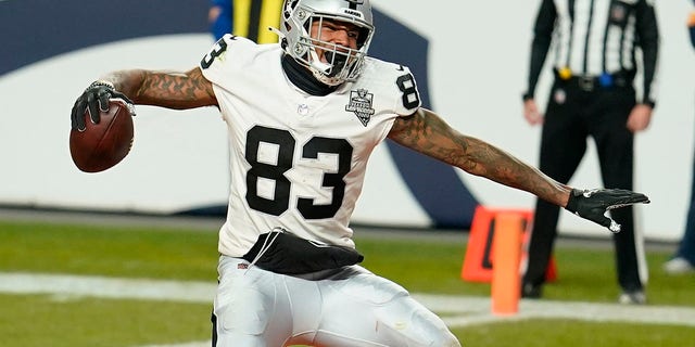 Las Vegas Raiders tight end Darren Waller celebrates after scoring a 2-point conversion against the Denver Broncos during the second half of an NFL game in Denver on Jan. 3, 2021.