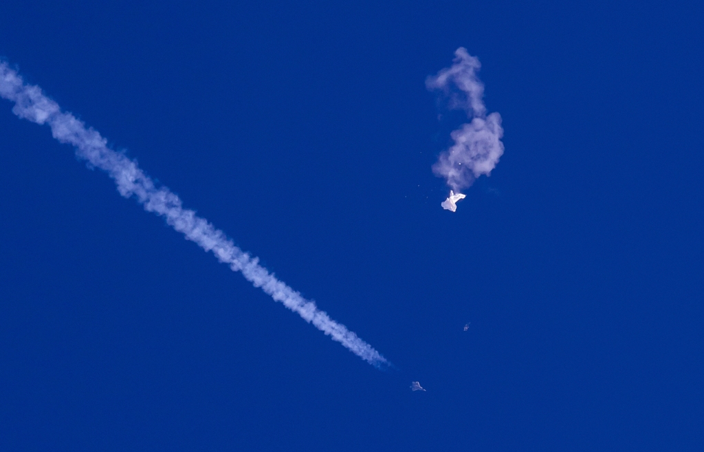 The remnants of the large balloon drift above the Atlantic Ocean after it was shot down on Feb. 4, 2023. 