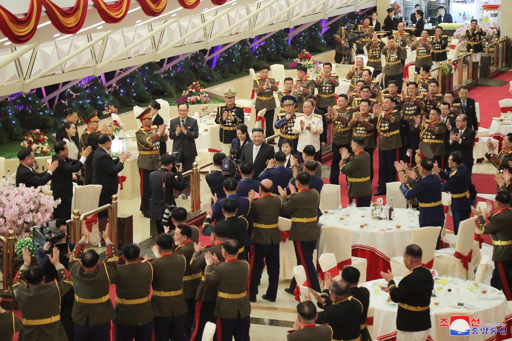 Kim Jong Un is greeted by attendants at the feast  for the 75th anniversary of the Korean People’s Army in North Korea on Feb. 7, 2023. 