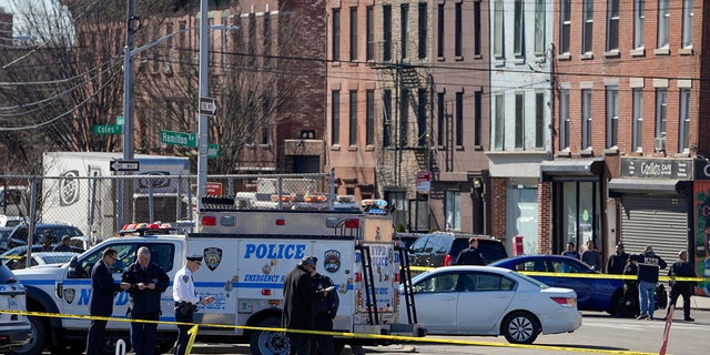 New York Police gather at the scene where a rental truck was stopped and the driver arrested, Monday, Feb. 13, 2023, in New York. Police stopped a U-Haul truck and detained the driver after reports that the vehicle struck multiple pedestrians in New York City on Monday. Authorities say the driver of the truck fled the scene after mounting a sidewalk in the Bay Ridge neighborhood of Brooklyn and injuring several people.