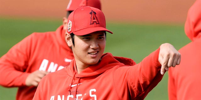 Los Angeles Angels' Shohei Ohtani gestures during a spring training baseball workout Friday, Feb. 17, 2023, in Phoenix. 