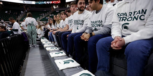 T-shirts are placed in the front row of the Breslin Center for the three killed and five injured Michigan State students before an NCAA college basketball game between Indiana and Michigan State on Tuesday, Feb. 21, 2023, in East Lansing, Mich. 