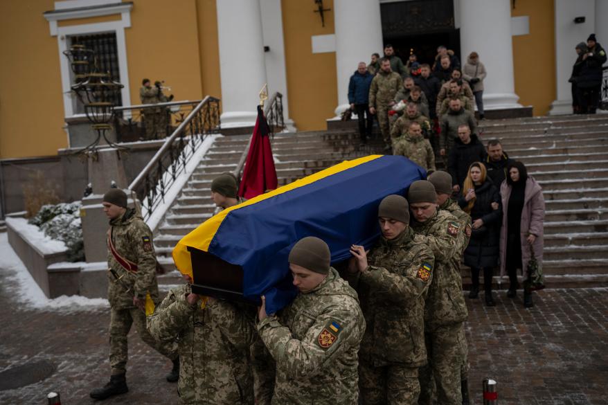 Soldiers carry the coffin of a Ukrainian serviceman who died in combat in Kyiv, Ukraine.