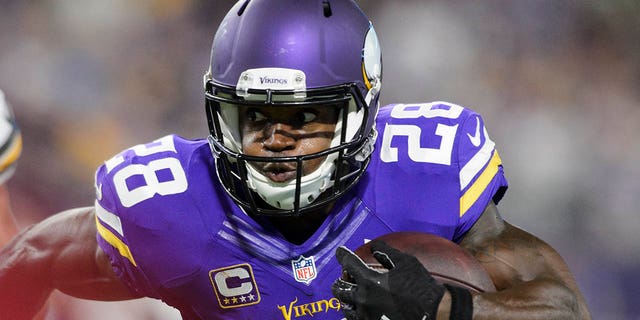 Adrian Peterson of the Minnesota Vikings carries the ball against the Green Bay Packers on Sept. 18, 2016, at U.S. Bank Stadium in Minneapolis.