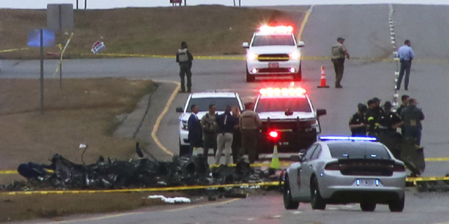 Law enforcement work at the scene of a Black Hawk helicopter crash Wednesday, Feb. 15, outside of Huntsville, Alabama. 