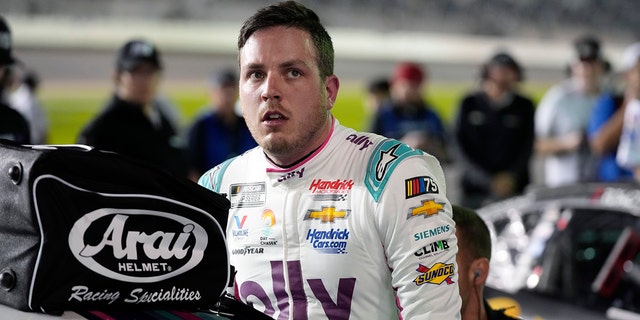 Alex Bowman climbs out of his car after qualifying for the NASCAR Daytona 500 auto race at Daytona International Speedway, Wednesday, Feb. 15, 2023, in Daytona Beach, Fla.