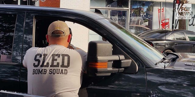 South Carolina Law Enforcement Division Bomb Squad officers arrive at the Colleton County Courthouse after a bomb threat caused the courthouse to be evacuated in Walterboro, S.C., Wednesday, February 7, 2023.