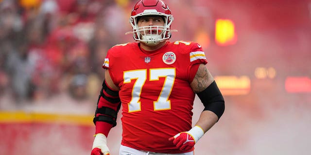 Andrew Wylie of the Kansas City Chiefs runs onto the field during introductions against the Jacksonville Jaguars at GEHA Field at Arrowhead Stadium Jan. 21, 2023, in Kansas City, Mo.