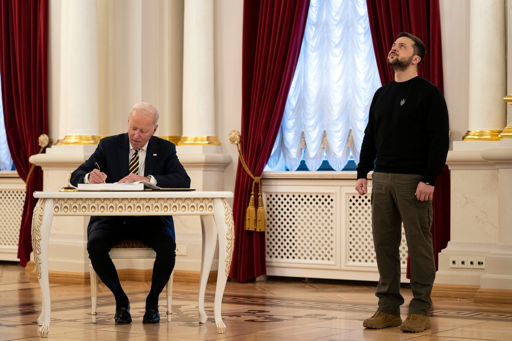 President Joe Biden signs a guest book during his meeting with Ukrainian President Volodymyr Zelenskyy at Mariinsky Palace during an unannounced visit in Kyiv, Ukraine, Monday, Feb. 20, 2023. 