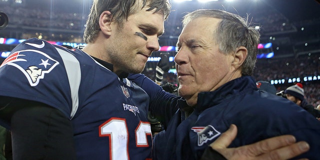 New England Patriots quarterback Tom Brady hugs head coach Bill Belichick after winning the AFC Championship game at Gillette Stadium on Sunday, Jan. 21, 2018.