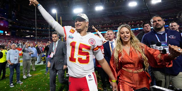 Kansas City Chiefs quarterback Patrick Mahomes leaves the field with his wife, Brittany, after Super Bowl LVII, Sunday, Feb. 12, 2023.