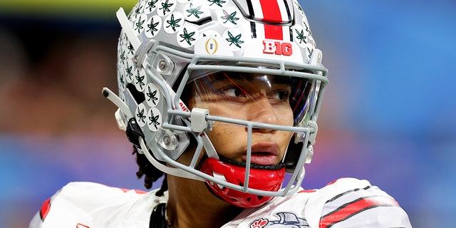 C.J. Stroud, #7 of the Ohio State Buckeyes, warms up before the start of the third quarter against the Georgia Bulldogs in the Chick-fil-A Peach Bowl at Mercedes-Benz Stadium on December 31, 2022, in Atlanta, Georgia.