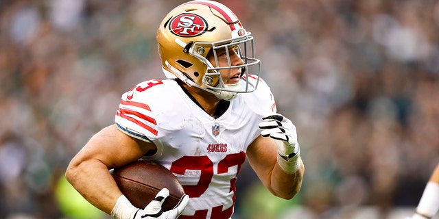 Christian McCaffrey #23 of the San Francisco 49ers carries the ball for a touchdown during the second quarter of the NFC Championship NFL football game against the Philadelphia Eagles at Lincoln Financial Field on January 29, 2023 in Philadelphia, Pennsylvania.