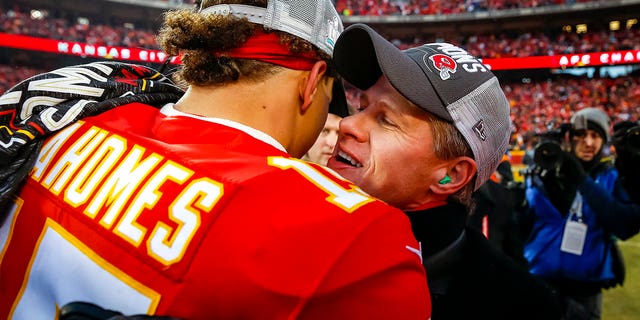 Clark Hunt, CEO and chairman of the Kansas City Chiefs, greets Patrick Mahomes, #15, on the football field during the celebration of the team's victory over the Tennessee Titans in the AFC Championship game at Arrowhead Stadium on January 19, 2020, in Kansas City, Missouri. 